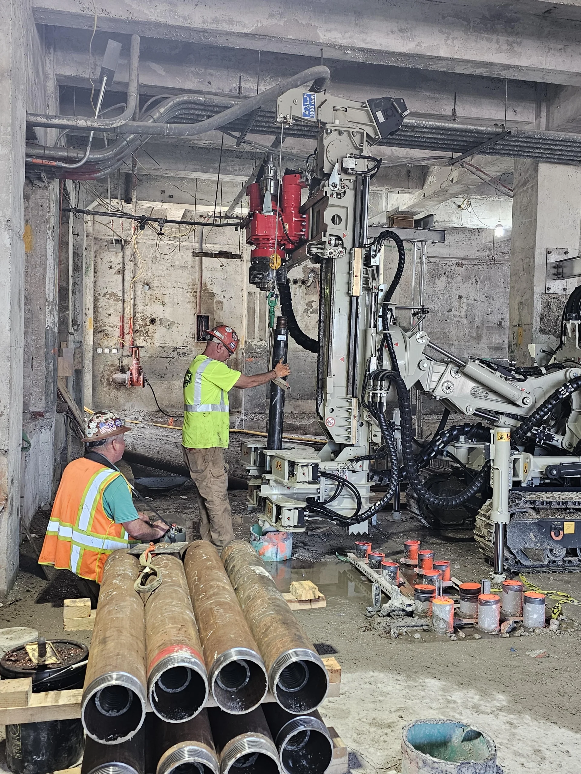 Tri-State worker with stack of large pipes