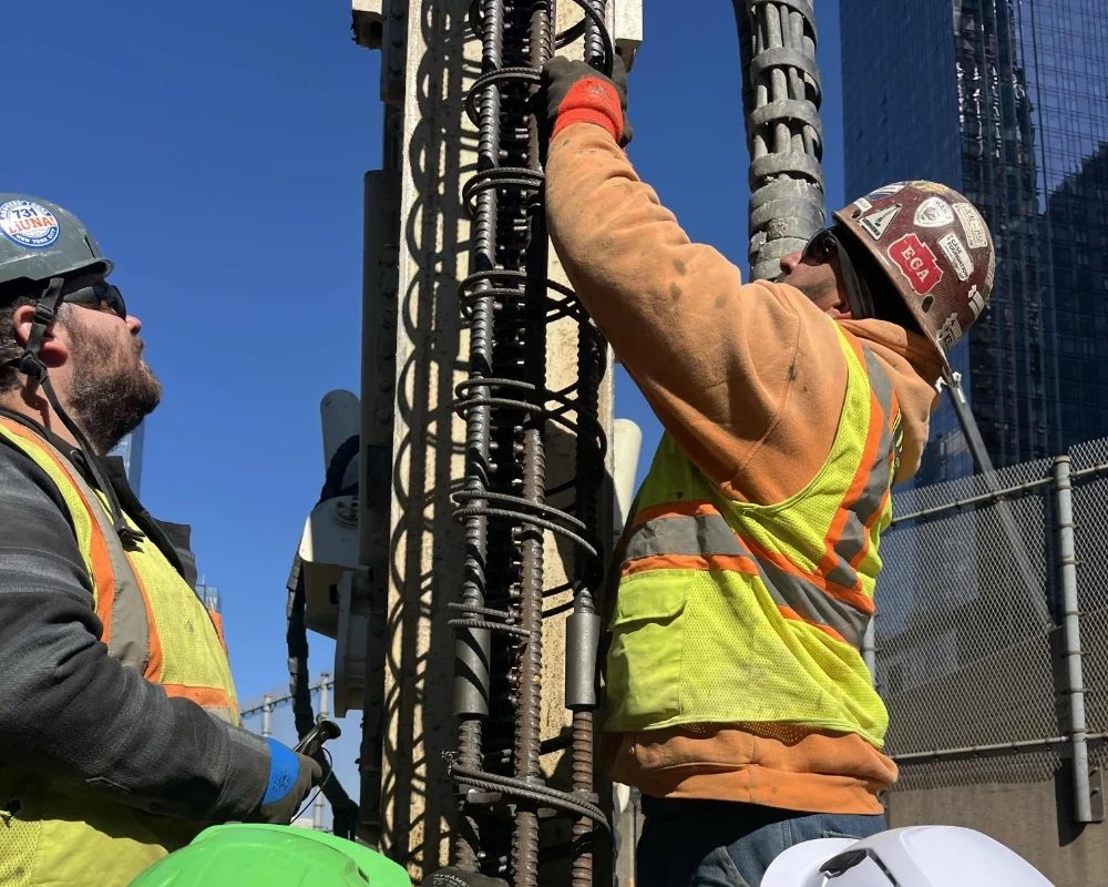 Tri-State crew members using a large construction drill