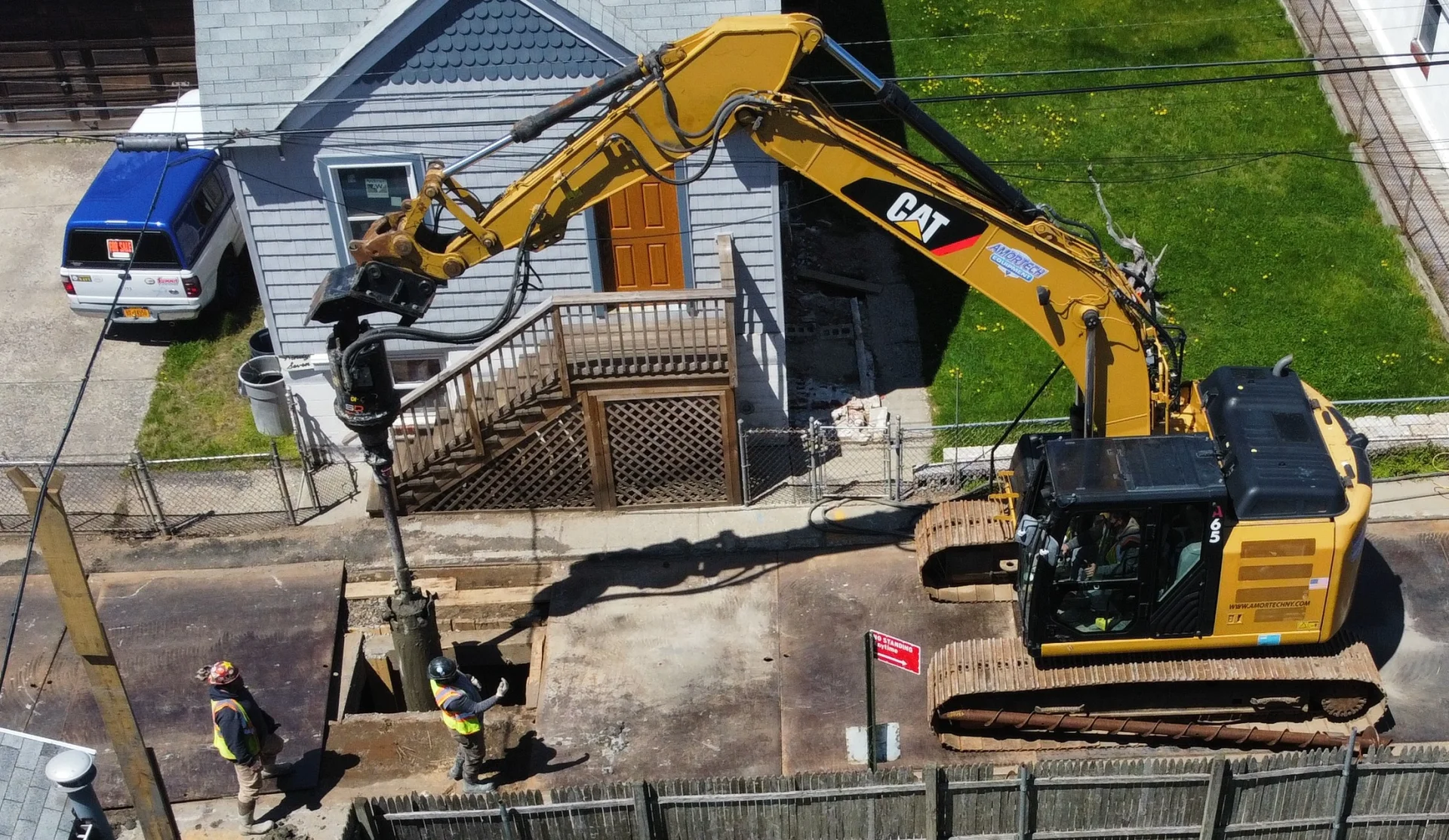 aerial view of drilling machine on residential road