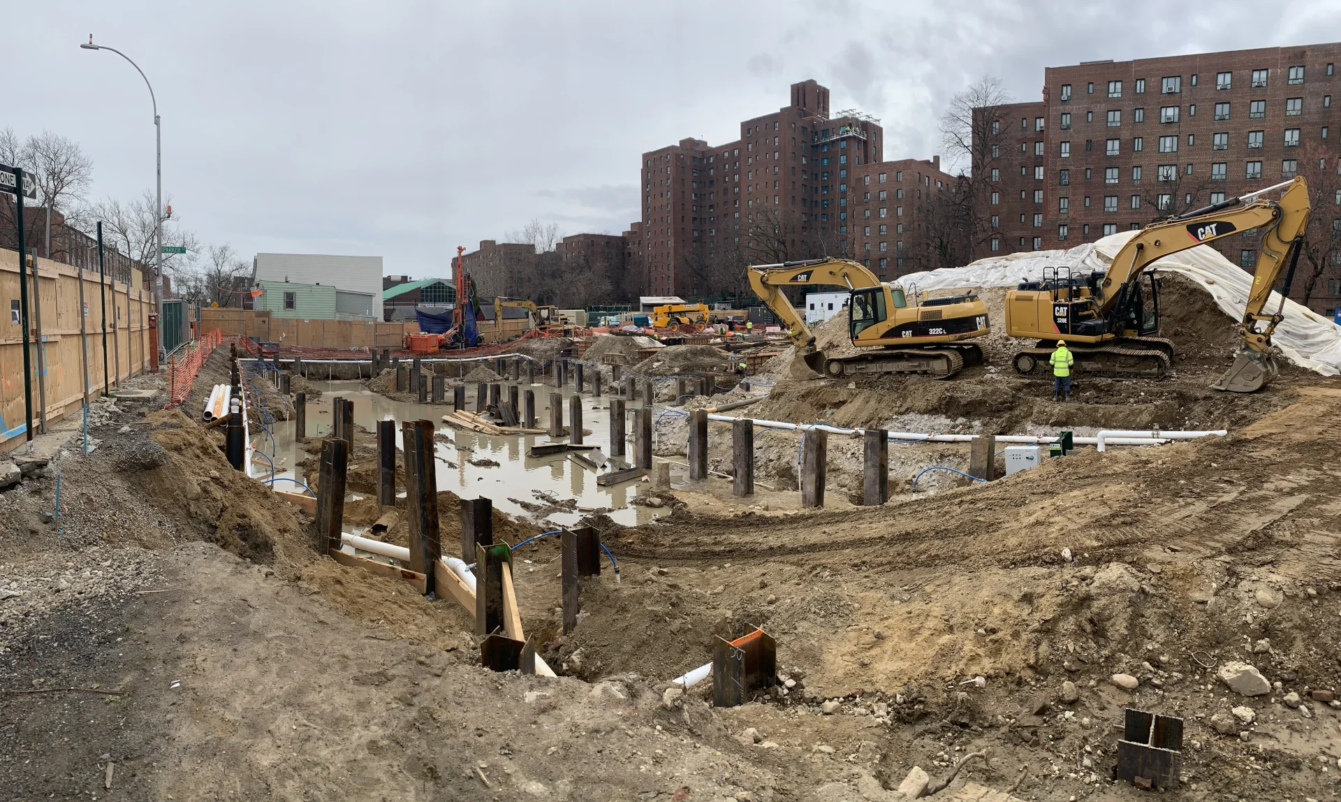 construction site with steel beams in the dirt and mud